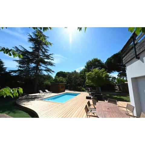 Closed wooden terrace and trees with equipped kitchen